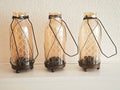 Drie vintage windlichten of kandelaars