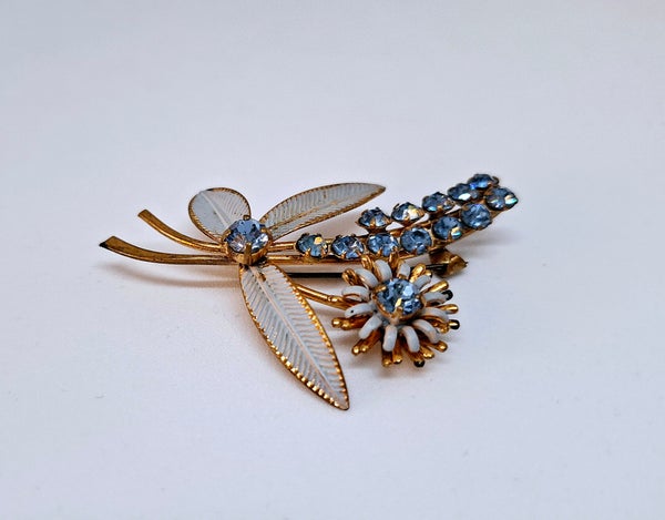 Vintage broche met blauwe strass